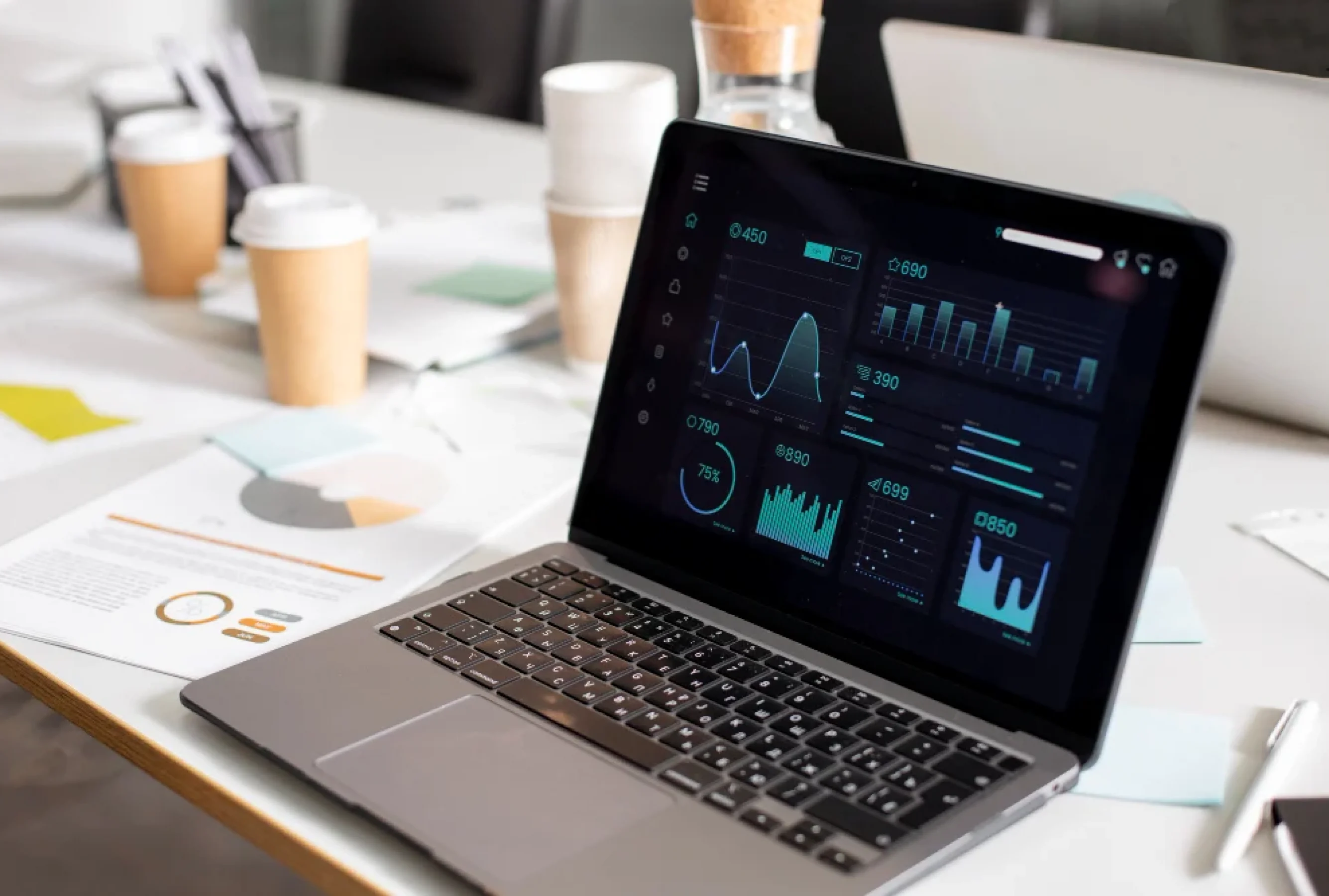 High-fidelity Figma prototype of an industrial dashboard on a professional laptop.